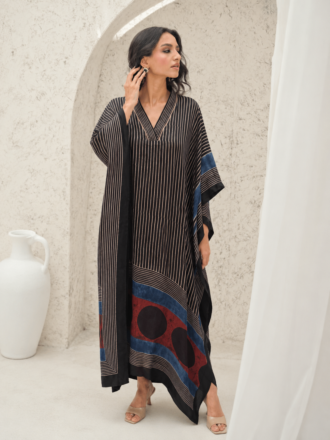 Black pinstripe kaftan with navy and red circle border – front view 1