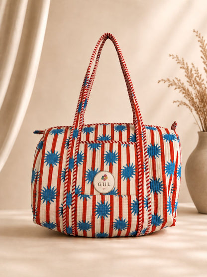 Orange and blue block print duffle bag, third view