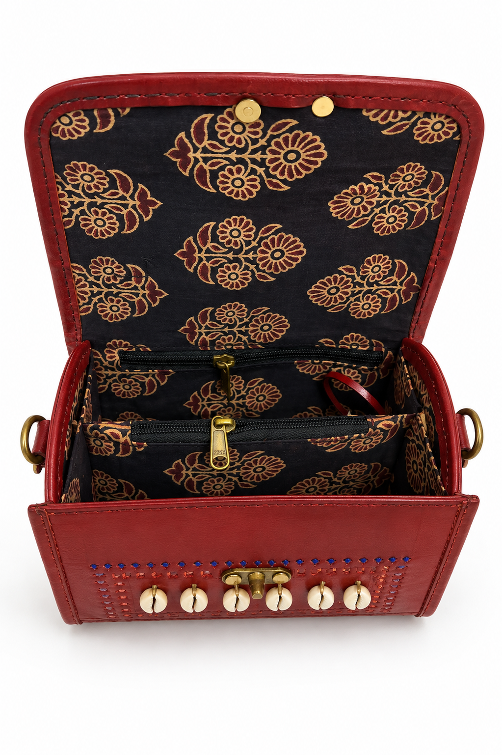 Brown leather cowrie shell trunk bag — interior full open