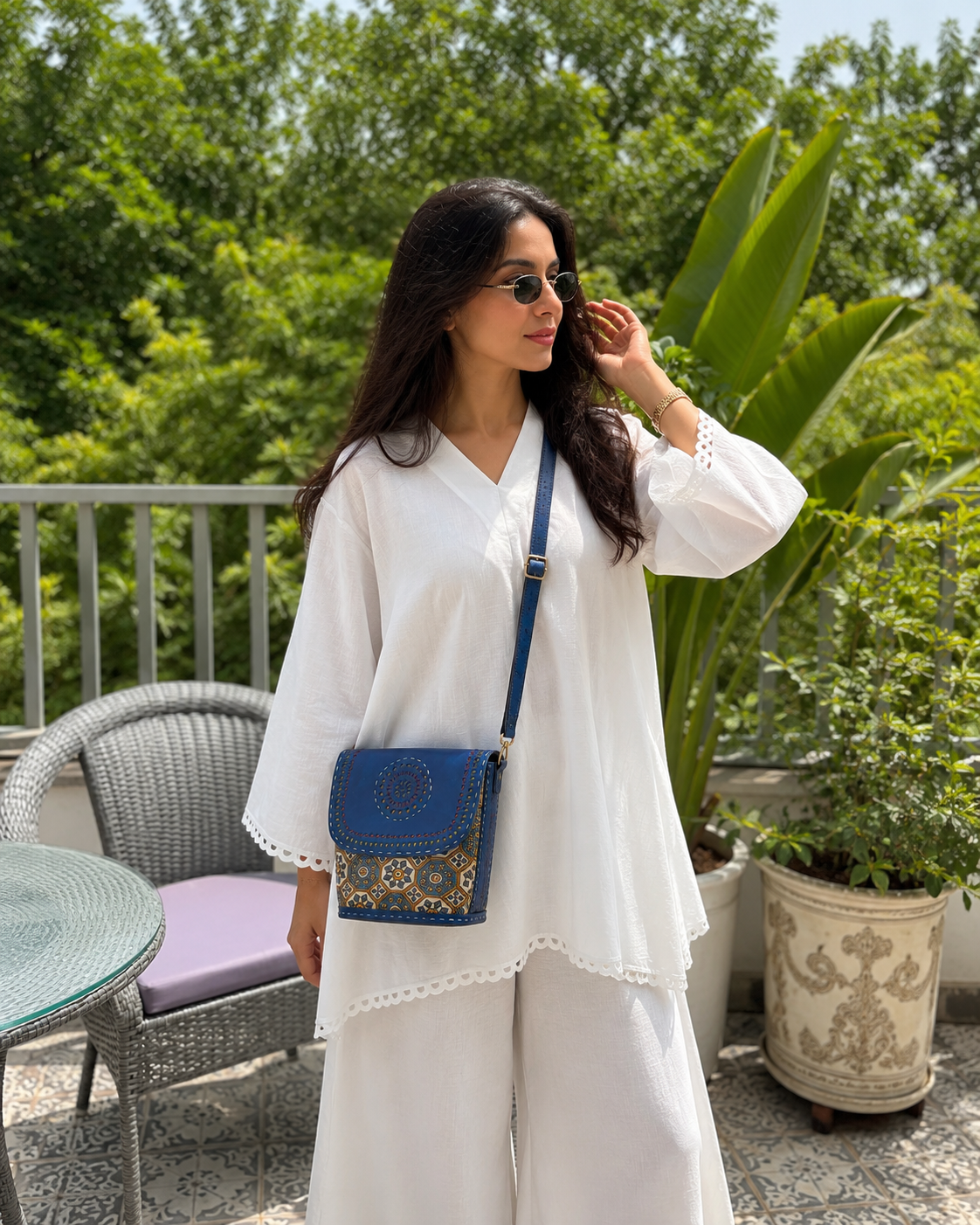 Navy mustard medallion box crossbody bag — lifestyle on rooftop