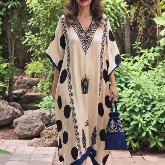 Ivory and navy polka modal silk kaftan by Gul, moving on the body