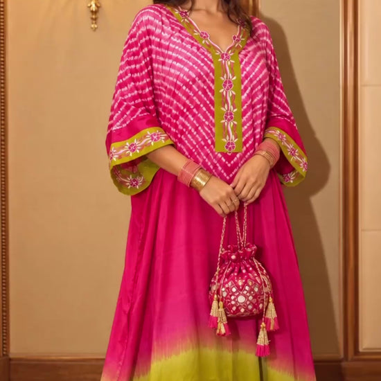 Pink and lime Shibori kaftan in modal silk, shown in movement