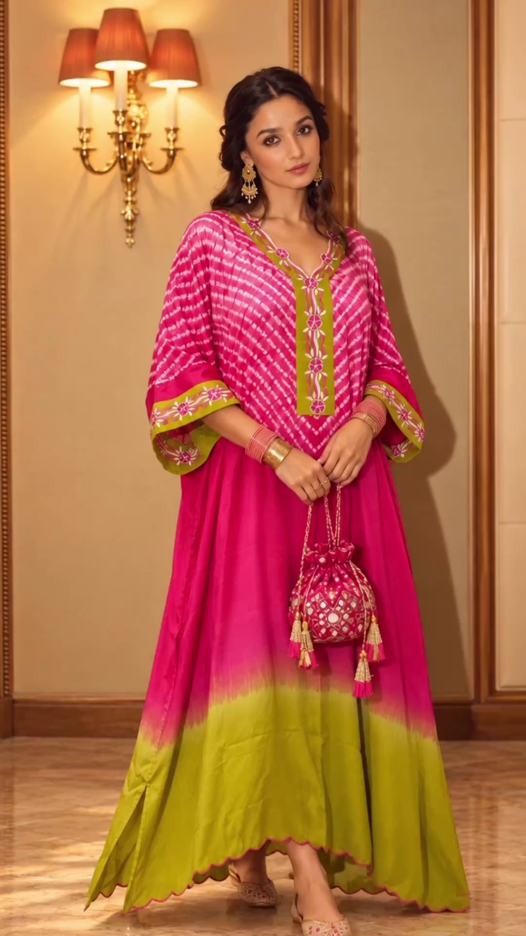 Pink and lime Shibori kaftan in modal silk, shown in movement